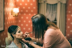 Indian bride getting her lipstick on. Indian bride getting her lipstick on.