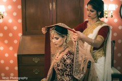 Enchanting Indian bride getting her wedding veil on. Enchanting Indian bride getting her wedding veil on.