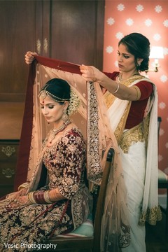 Dazzling indian bride getting her ghoonghat on. Dazzling indian bride getting her ghoonghat on.