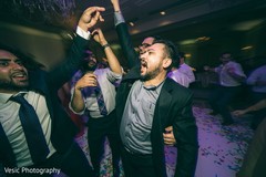 Gleeful indian wedding reception dance. Gleeful indian wedding reception dance.