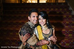Indian bride and groom posing for pictures Indian bride and groom posing for pictures