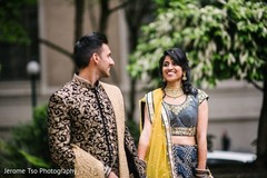 Indian bride and groom posing outdoors Indian bride and groom posing outdoors