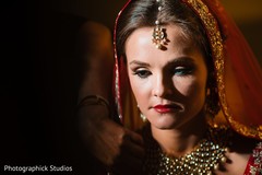 Lovely Indian bride getting her hair and makeup done. Lovely Indian bride getting her hair and makeup done.