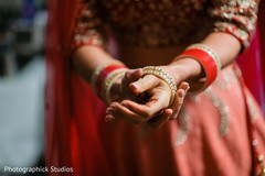 Sweet indian bride putting bangles on Sweet indian bride putting bangles on