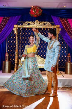 Indian bride and groom at their Sangeet celebration. Indian bride and groom at their Sangeet celebration.