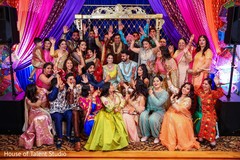 Indian bride and groom's with guests at sangeet photo shoot. Indian bride and groom's with guests at sangeet photo shoot.