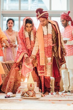 Indian bride and groom during the sacred fire rituals Indian bride and groom during the sacred fire rituals