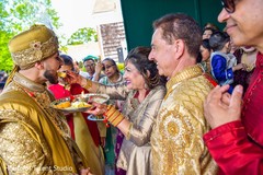 Rajah at Indian wedding milni ritual capture. Rajah at Indian wedding milni ritual capture.