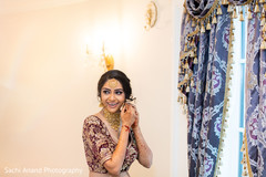 Lovely Indian bride getting her jewelry on. Lovely Indian bride getting her jewelry on.