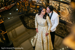 Lovely Indian groom kissing bride photo session. Lovely Indian groom kissing bride photo session.