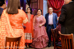 Lovely Indian bride entering Engagement party with relatives. Lovely Indian bride entering Engagement party with relatives.
