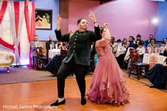 Upbeat Indian lovebirds dance at engagement party. Upbeat Indian lovebirds dance at engagement party.