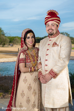 Indian bride and groom posing for pictures Indian bride and groom posing for pictures