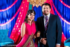 Indian bride and groom posing for pictures Indian bride and groom posing for pictures