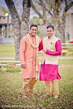 Indian groom posing outdoors with groomsmen. Indian groom posing outdoors with groomsmen.