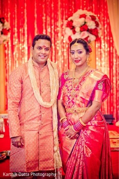 Lovely Indian couple posing with ceremony outfits. Lovely Indian couple posing with ceremony outfits.