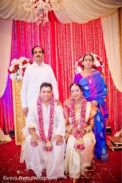 Enchanting Indian couple posing with relatives. Enchanting Indian couple posing with relatives.