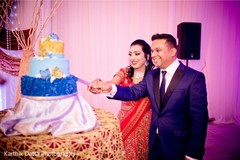 Lovey indian couple cutting the cake. Lovey indian couple cutting the cake.