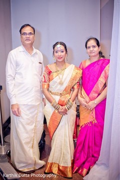 Enchanting Indian bride posing with relatives for photo shoot. Enchanting Indian bride posing with relatives for photo shoot.