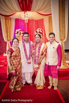 Enchanting Indian couple posing at ceremony mandap. Enchanting Indian couple posing at ceremony mandap.