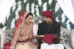 Beautiful Indian bride putting the ring on her Indian groom. Beautiful Indian bride putting the ring on her Indian groom.