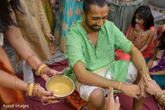 Rajah being smeared with turmeric paste. Rajah being smeared with turmeric paste.