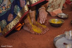 Closeup capture of maharani's feet with turmeric paste on. Closeup capture of maharani's feet with turmeric paste on.