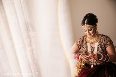 Enchanting Indian bride getting her ceremony jewelry. Enchanting Indian bride getting her ceremony jewelry.
