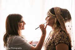 Maharani getting her ceremony lipstick on. Maharani getting her ceremony lipstick on.