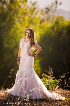 Enchanting Indian bride on her white wedding dress. Enchanting Indian bride on her white wedding dress.