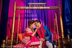 Romantic Indian bride and groom looking at each other. Romantic Indian bride and groom looking at each other.