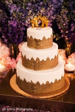 Elegant Indian wedding golden and white cake decor. Elegant Indian wedding golden and white cake decor.