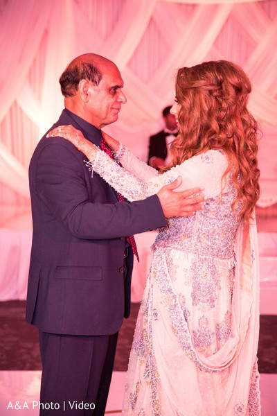 Sweet indian bride dancing with her father