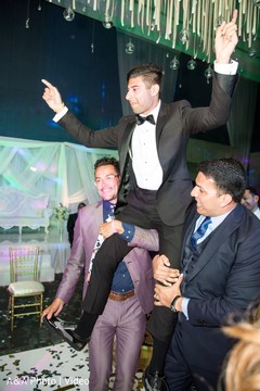 Indian groom being lifted up capture Indian groom being lifted up capture
