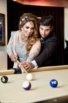 Lovely couple playing pool together. Lovely couple playing pool together.