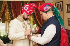 See this Indian groom putting his sherwani on. See this Indian groom putting his sherwani on.