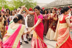 Indian bridesmaids dancing at baraat procession. Indian bridesmaids dancing at baraat procession.
