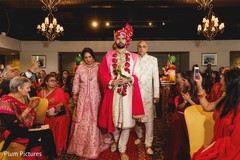 Indian groom walking down the ceremony aisle. Indian groom walking down the ceremony aisle.