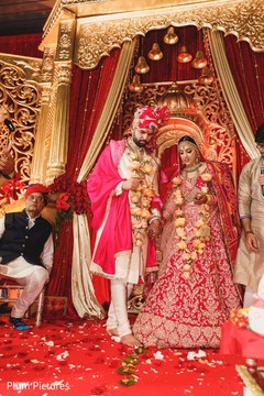 Indian groom and bride touches with toe seven nuts. Indian groom and bride touches with toe seven nuts.