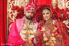 Indian lovebirds showing wedding rings. Indian lovebirds showing wedding rings.