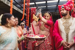 Bride throwing rice on her back ritual. Bride throwing rice on her back ritual.
