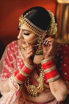 Enchanting Indian bride putting her jewelry on. Enchanting Indian bride putting her jewelry on.