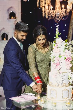 Indian couple cutting cake scene. Indian couple cutting cake scene.