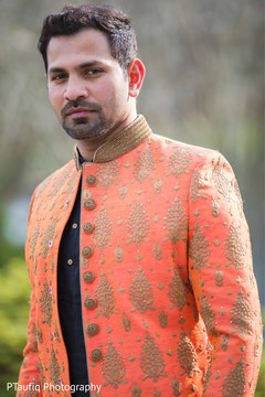 Joyful Indian groom on his sangeet sherwani. Joyful Indian groom on his sangeet sherwani.