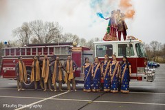 Incredible Indian couple posing on a fire truck. Incredible Indian couple posing on a fire truck.