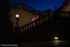 Elegant Indian couple posing on the stairs outdoors. Elegant Indian couple posing on the stairs outdoors.