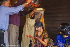 Indian bride being showered with water. Indian bride being showered with water.