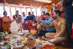 Indian groom holding a pre-wedding coconut. Indian groom holding a pre-wedding coconut.
