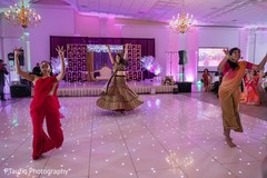 Indian bride dancing with bridesmaids at reception. Indian bride dancing with bridesmaids at reception.