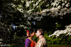 Indian bride and groom posing for pictures Indian bride and groom posing for pictures